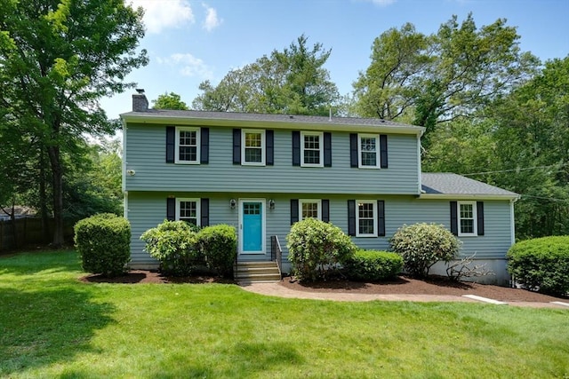 216 Davis St, Northborough, MA 01532 - colonial home with a chimney and a front yard