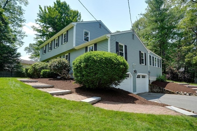 216 Davis St, Northborough, MA 01532 - view of home's exterior with an attached garage, driveway, and a yard