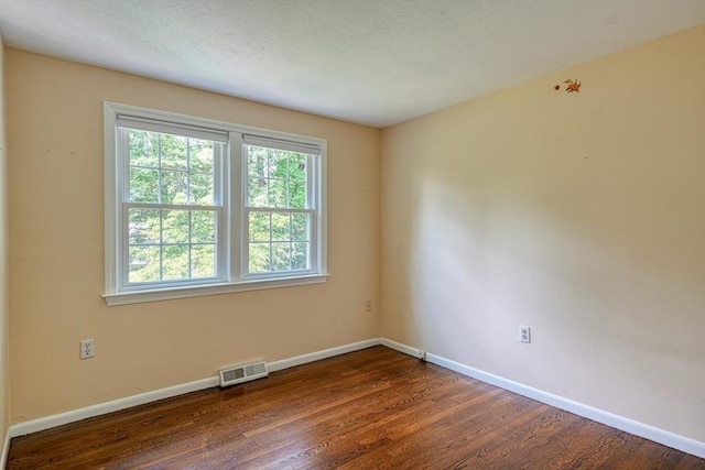 216 Davis St, Northborough, MA 01532 - spare room featuring baseboards and dark wood-style floors