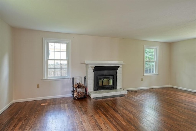 216 Davis St, Northborough, MA 01532 - unfurnished living room with wood finished floors and a brick fireplace