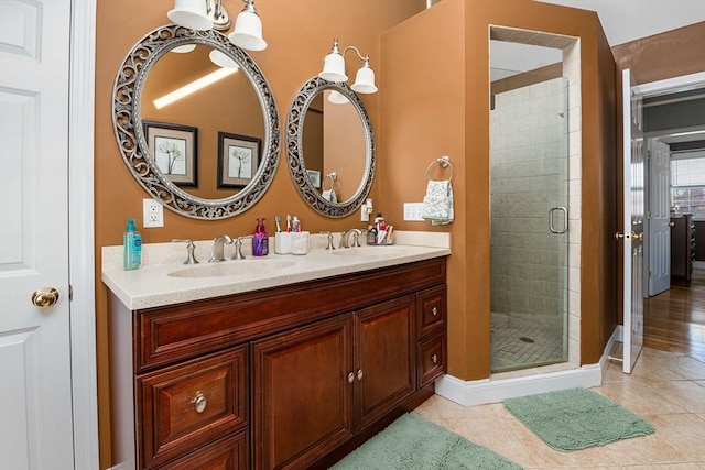 bathroom featuring an enclosed shower, vanity, and tile patterned floors