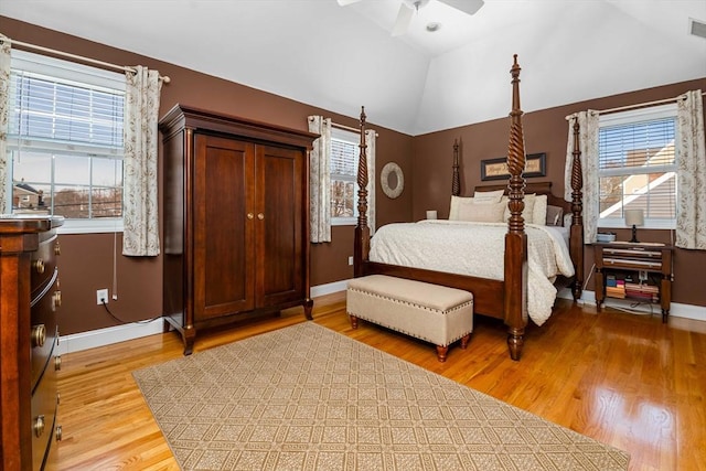 bedroom featuring ceiling fan, lofted ceiling, and light hardwood / wood-style floors