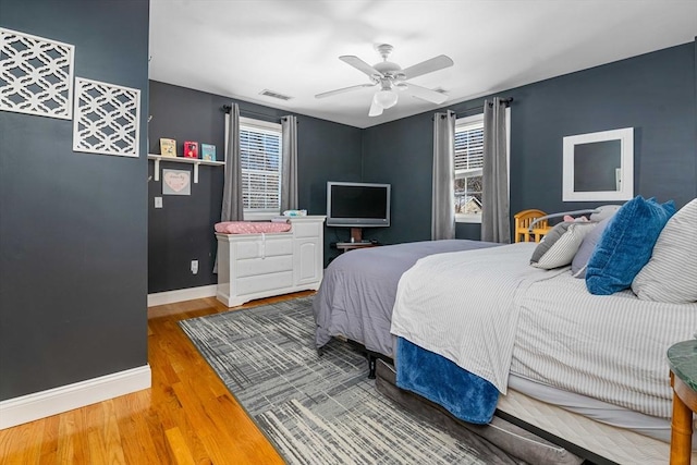 bedroom featuring wood-type flooring and ceiling fan