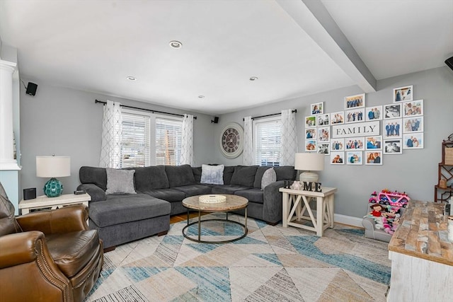 living room with beam ceiling