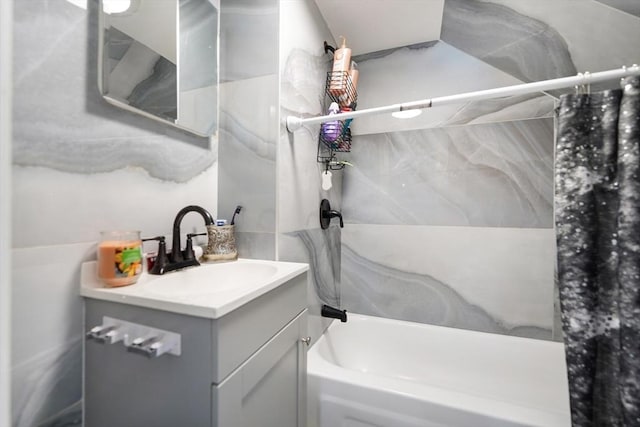 bathroom with vanity and shower / bath combo