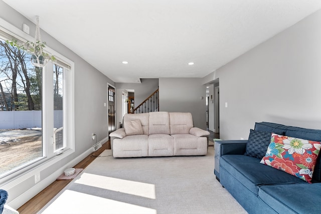 living room with stairway, recessed lighting, wood finished floors, and baseboards