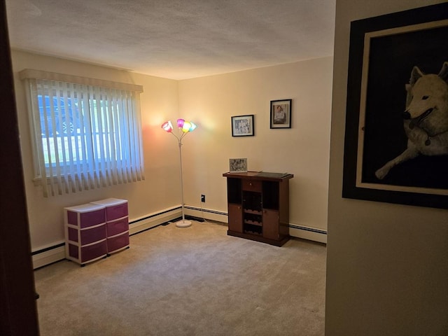 82 Lionel Ave Unit B, Waltham, MA 02452 - carpeted spare room with a baseboard heating unit