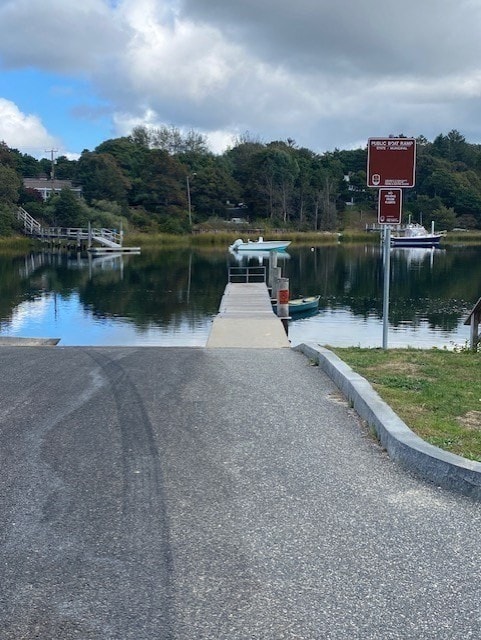 property view of water with a dock