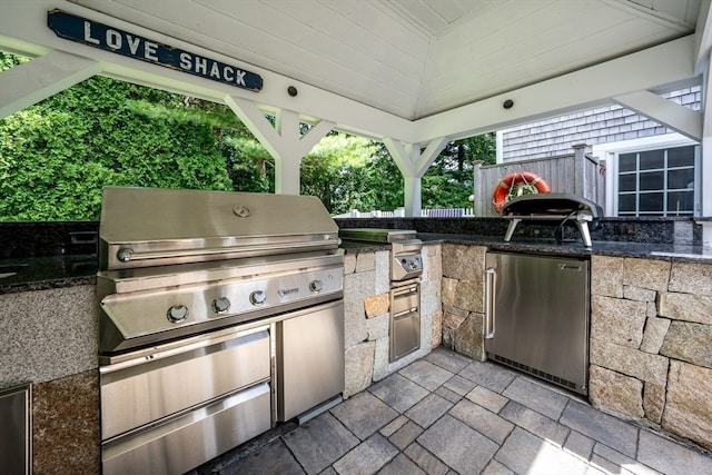 view of patio / terrace with area for grilling and a grill