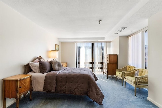 carpeted bedroom featuring access to exterior, visible vents, multiple windows, and a textured ceiling