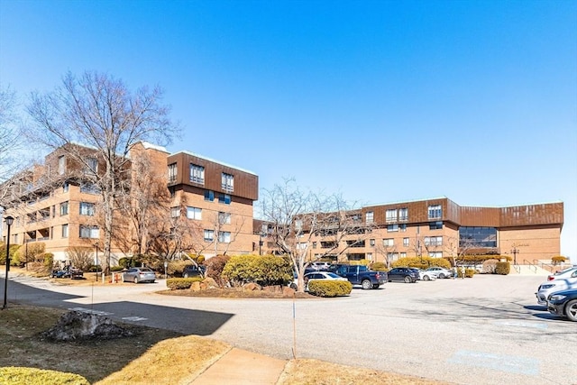 view of property with uncovered parking