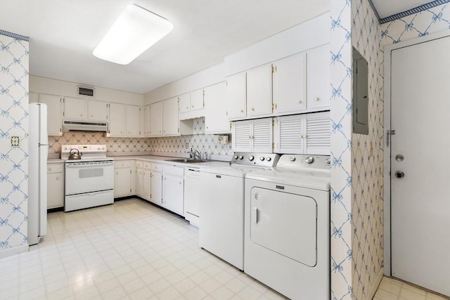 laundry area featuring light floors, visible vents, laundry area, electric panel, and washer and dryer