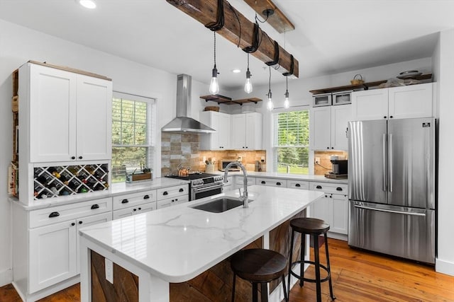 166 Littleton Unit 3, Harvard, MA 01451 - kitchen featuring stainless steel appliances, wall chimney exhaust hood, tasteful backsplash, and recessed lighting
