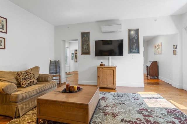166 Littleton Unit 3, Harvard, MA 01451 - living area featuring an AC wall unit and wood finished floors