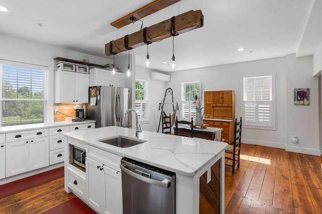 166 Littleton Unit 3, Harvard, MA 01451 - kitchen with appliances with stainless steel finishes, recessed lighting, dark wood-type flooring, an AC wall unit, and white cabinets