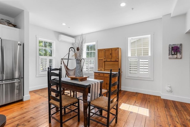 166 Littleton Unit 3, Harvard, MA 01451 - dining area with a wall mounted AC, light wood-style floors, and recessed lighting