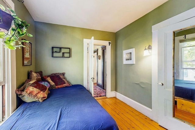 239 Arlington St, Acton, MA 01720 - bedroom with light wood-style floors and baseboards