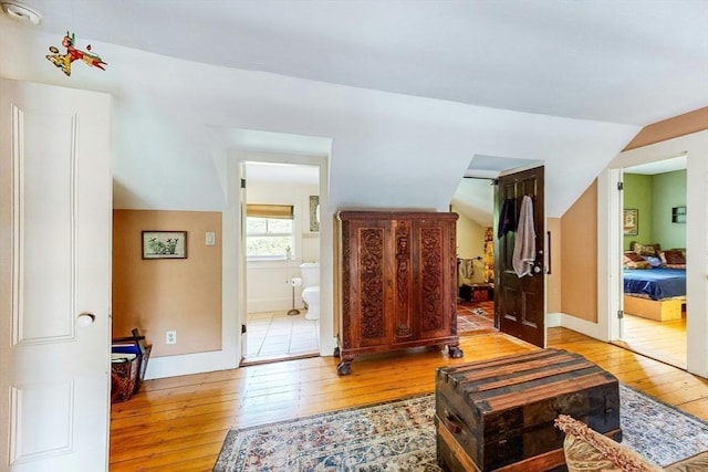 239 Arlington St, Acton, MA 01720 - living room featuring hardwood / wood-style floors and vaulted ceiling