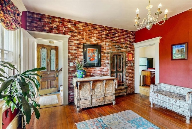 239 Arlington St, Acton, MA 01720 - entrance foyer with hardwood / wood-style flooring and a chandelier