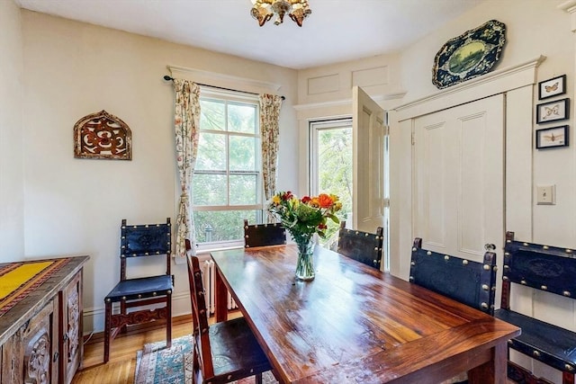 239 Arlington St, Acton, MA 01720 - dining room with wood finished floors and a chandelier