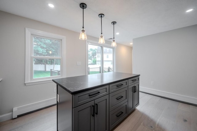 5 Betsy Ln Unit 5, Chelmsford, MA 01824 - kitchen with a baseboard heating unit, healthy amount of natural light, light wood-type flooring, recessed lighting, and hanging light fixtures