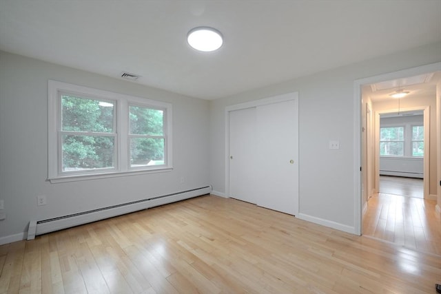 5 Betsy Ln Unit 5, Chelmsford, MA 01824 - unfurnished bedroom featuring a baseboard heating unit, attic access, baseboard heating, light wood finished floors, and a closet