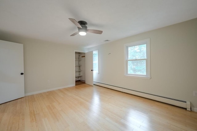 5 Betsy Ln Unit 5, Chelmsford, MA 01824 - unfurnished room with a baseboard heating unit, wood finished floors, and a ceiling fan