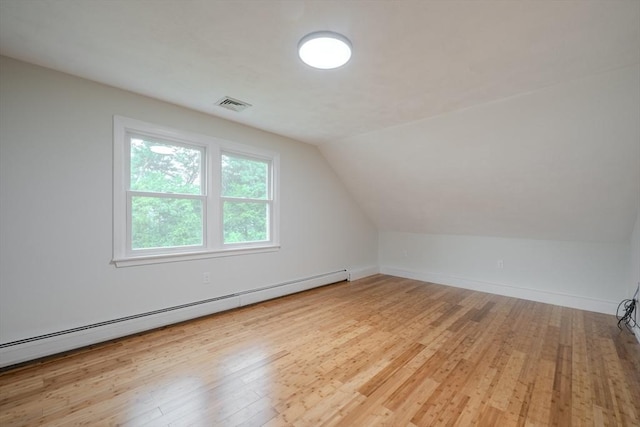 5 Betsy Ln Unit 5, Chelmsford, MA 01824 - bonus room with a baseboard heating unit, wood finished floors, and lofted ceiling