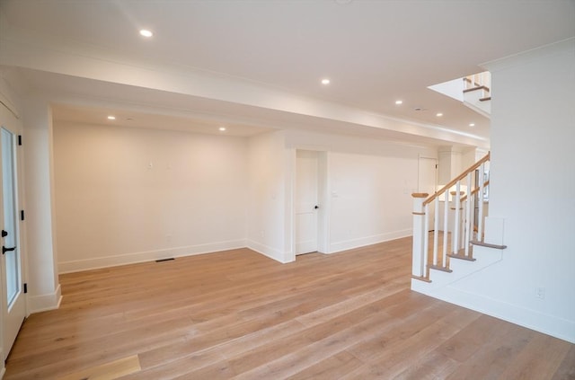 182 Merrimac St Unit 1, Newburyport, MA 01950 - below grade area with stairs, light wood finished floors, and recessed lighting