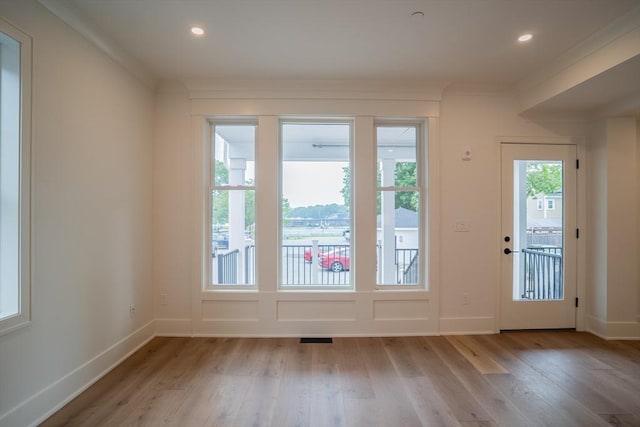 182 Merrimac St Unit 1, Newburyport, MA 01950 - doorway to outside featuring light wood-type flooring, ornamental molding, and recessed lighting