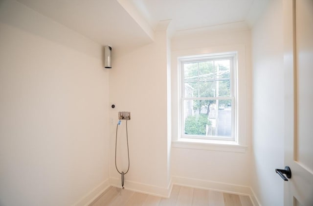 182 Merrimac St Unit 1, Newburyport, MA 01950 - washroom with plenty of natural light, light wood finished floors, and hookup for a washing machine