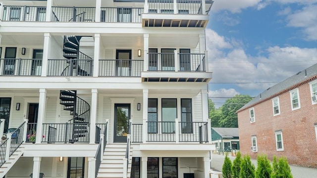 182 Merrimac St Unit 1, Newburyport, MA 01950 - view of front of house with stairs and a balcony