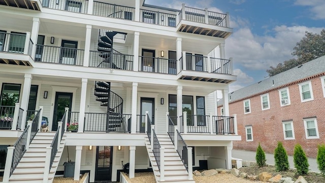 182 Merrimac St Unit 1, Newburyport, MA 01950 - coastal inspired home with stairs, a porch, and a balcony