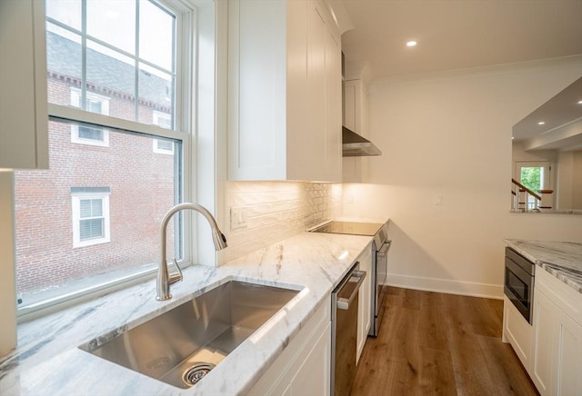182 Merrimac St Unit 1, Newburyport, MA 01950 - kitchen featuring appliances with stainless steel finishes, white cabinets, backsplash, crown molding, and recessed lighting