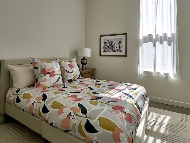 bedroom featuring baseboards