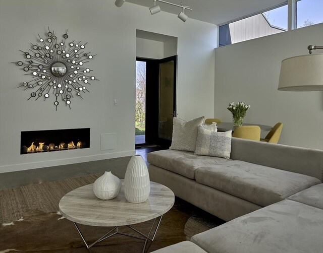 1 River Run Unit 1, Williamstown, MA 01267 - living room featuring track lighting and a warm lit fireplace