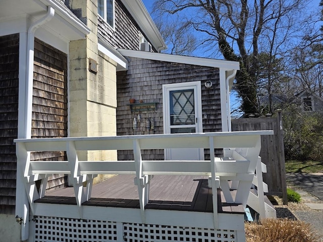view of side of home with a wooden deck