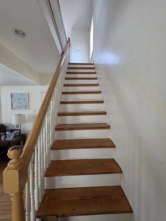 stairway with wood-type flooring