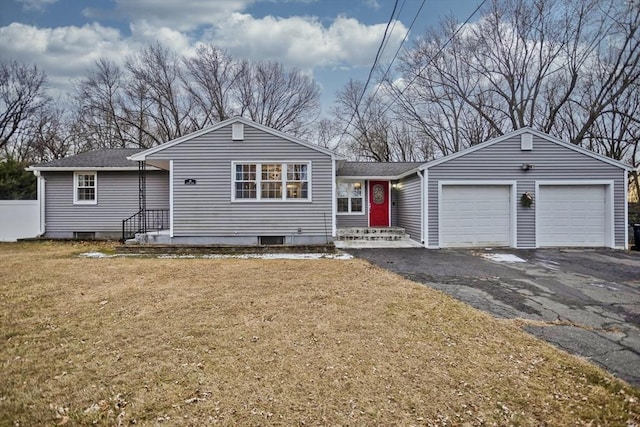 view of front of house featuring a front lawn and a garage