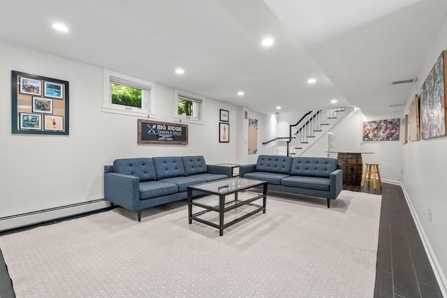 57 Glenham St, Boston, MA 02132 - living room with wood finished floors, a bar, recessed lighting, stairs, and a baseboard heating unit
