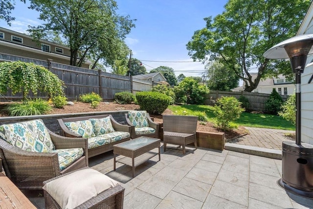 57 Glenham St, Boston, MA 02132 - fenced backyard with a patio area and an outdoor hangout area