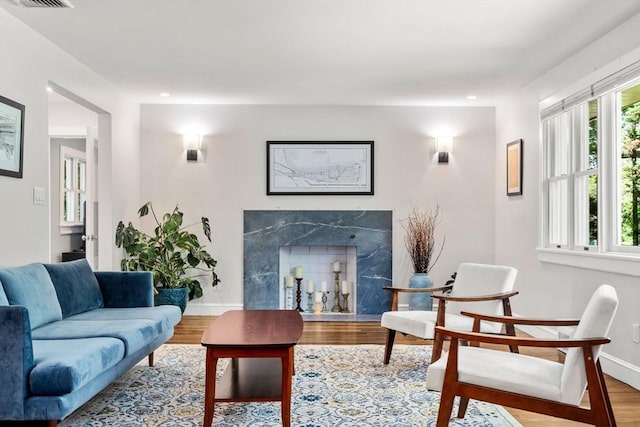 57 Glenham St, Boston, MA 02132 - living room with wood finished floors, a premium fireplace, and recessed lighting