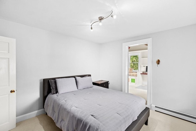 148 Pond St, Cohasset, MA 02025 - bedroom with baseboard heating, light colored carpet, and baseboards