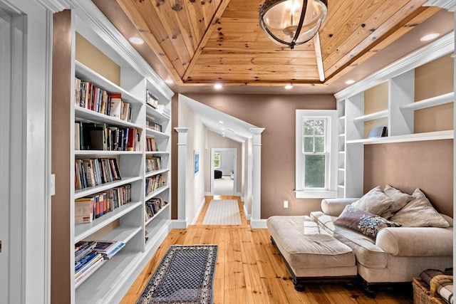 148 Pond St, Cohasset, MA 02025 - sitting room featuring wooden ceiling, a raised ceiling, light wood-type flooring, baseboards, and built in shelves