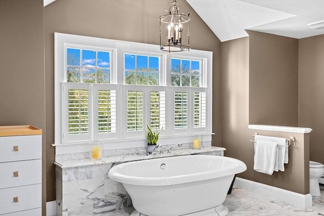 148 Pond St, Cohasset, MA 02025 - bathroom featuring marble tiled flooring, a soaking tub, a chandelier, vaulted ceiling, and toilet