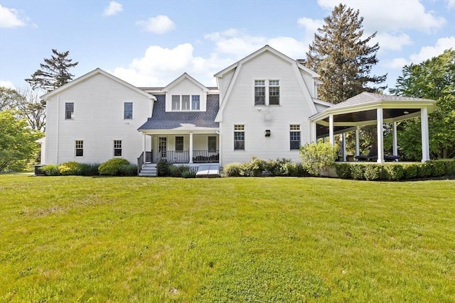 148 Pond St, Cohasset, MA 02025 - rear view of house with covered porch, a gazebo, a lawn, a shingled roof, and a gambrel roof