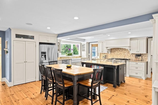 148 Pond St, Cohasset, MA 02025 - dining room featuring light wood-style floors and recessed lighting