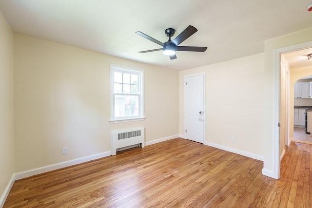 76 Wolcott Ave, West Springfield, MA 01089 - unfurnished room with radiator heating unit, light wood-style floors, baseboards, and ceiling fan