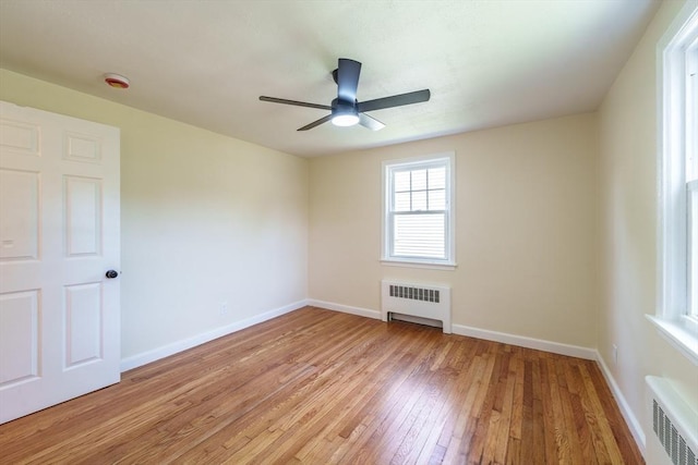 76 Wolcott Ave, West Springfield, MA 01089 - unfurnished room featuring radiator heating unit, light wood finished floors, baseboards, ceiling fan, and a smoke detector