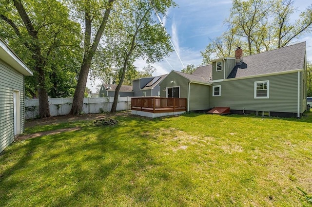 76 Wolcott Ave, West Springfield, MA 01089 - back of house with a deck, a chimney, and roof with shingles